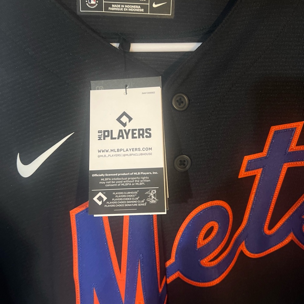 Nike Black Jersey with Vibrant Orange and Blue Details